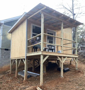Wide porch completed on the Midnight Falcon art studio, ready to be used as an extended workspace.